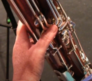 left hand with thumb on low Bb key