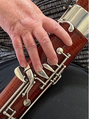 shows good right-hand finger position