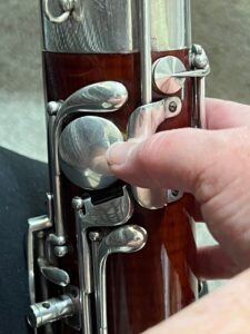 right thumb resting on low E key guard