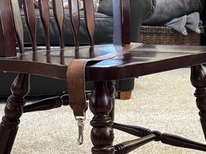seatstrap properly placed on armless chair