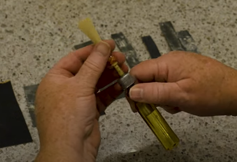 mandrel inserted in tube of reed